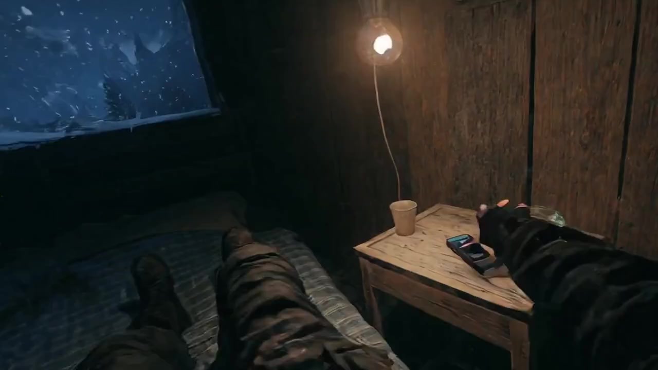 horseshoe shaped snowey mountain in the winter with lit up houses all along, miles across